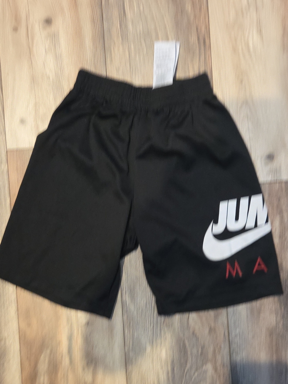 Nike Black Men's Athletic Shorts with White Swoosh and Red Accents